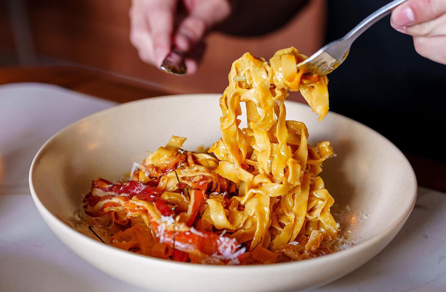 Someone with pasta at Itameshi.